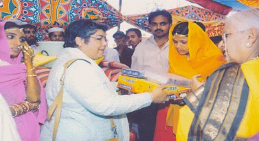 Gifts being distributed by Ms. Parul Devidas Joint Secretary Women and Child Development, New Delhi.